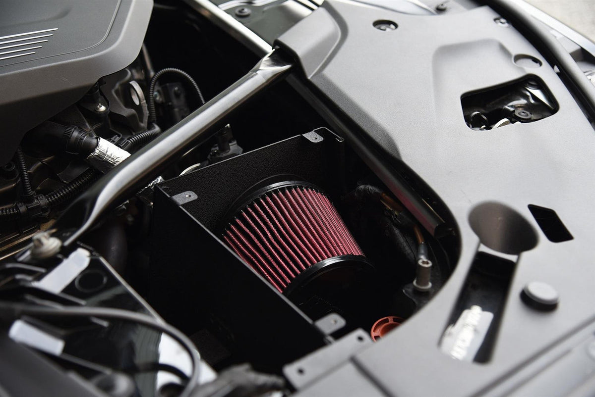 MST Performance induction kit for BMW B58 540i showing air intake components and hoses in a close-up view
