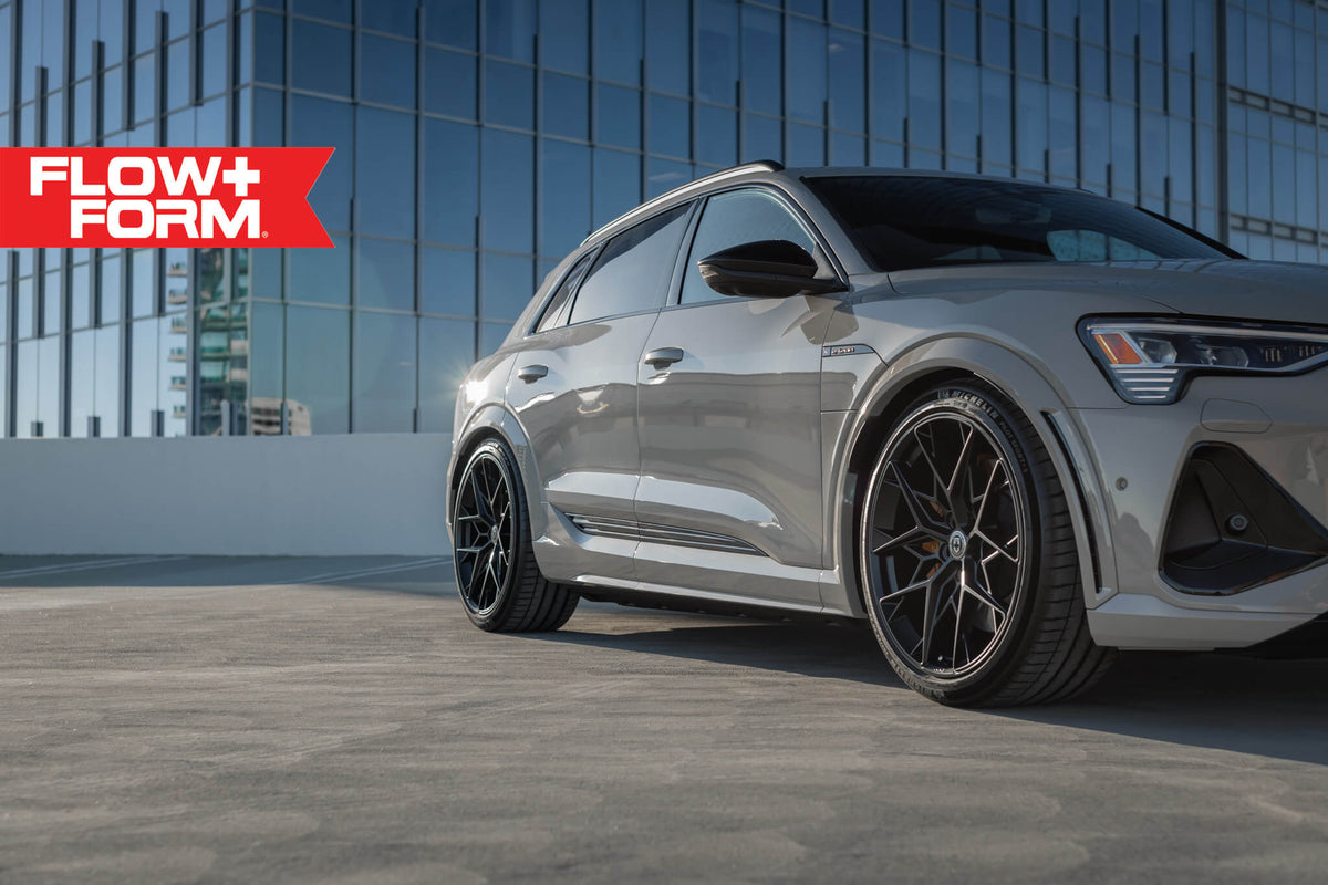 HRE PERFORMANCE WHEELS FF10 alloy wheels with multi-spoke design and metallic finish, shown on a vehicle.