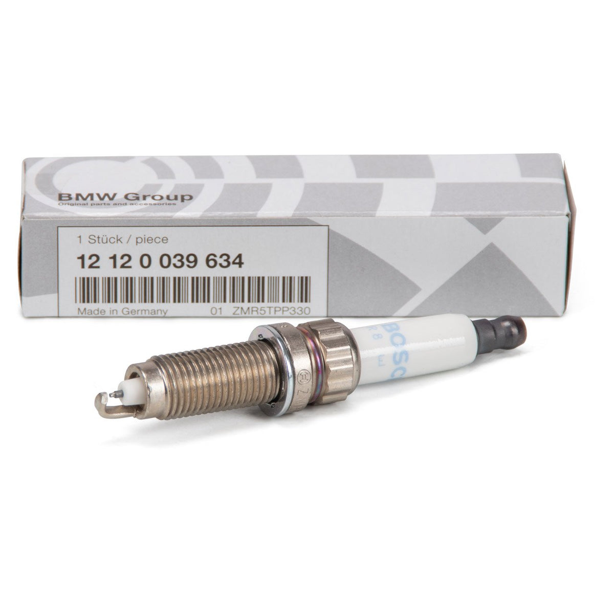Genuine BMW N55, S55, S63 spark plugs, model 12120039634, showing the metal and ceramic components of the ignition spark plug.
