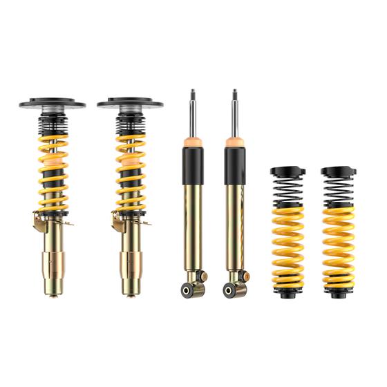 ST Suspension ST XTA plus 3 coilovers for BMW F87 M2 with adjustable damping and top mounts, shown installed on the vehicle.