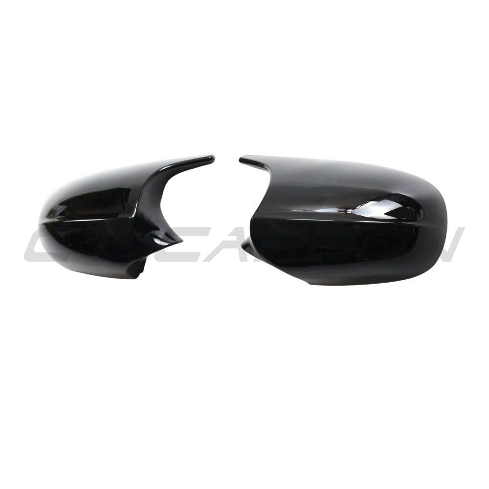 Pair of CT Carbon gloss black BMW 1 & 3 Series E82/E83/E87/E88/E90/E91/E92/E93 mirrors, showing sleek exterior design.