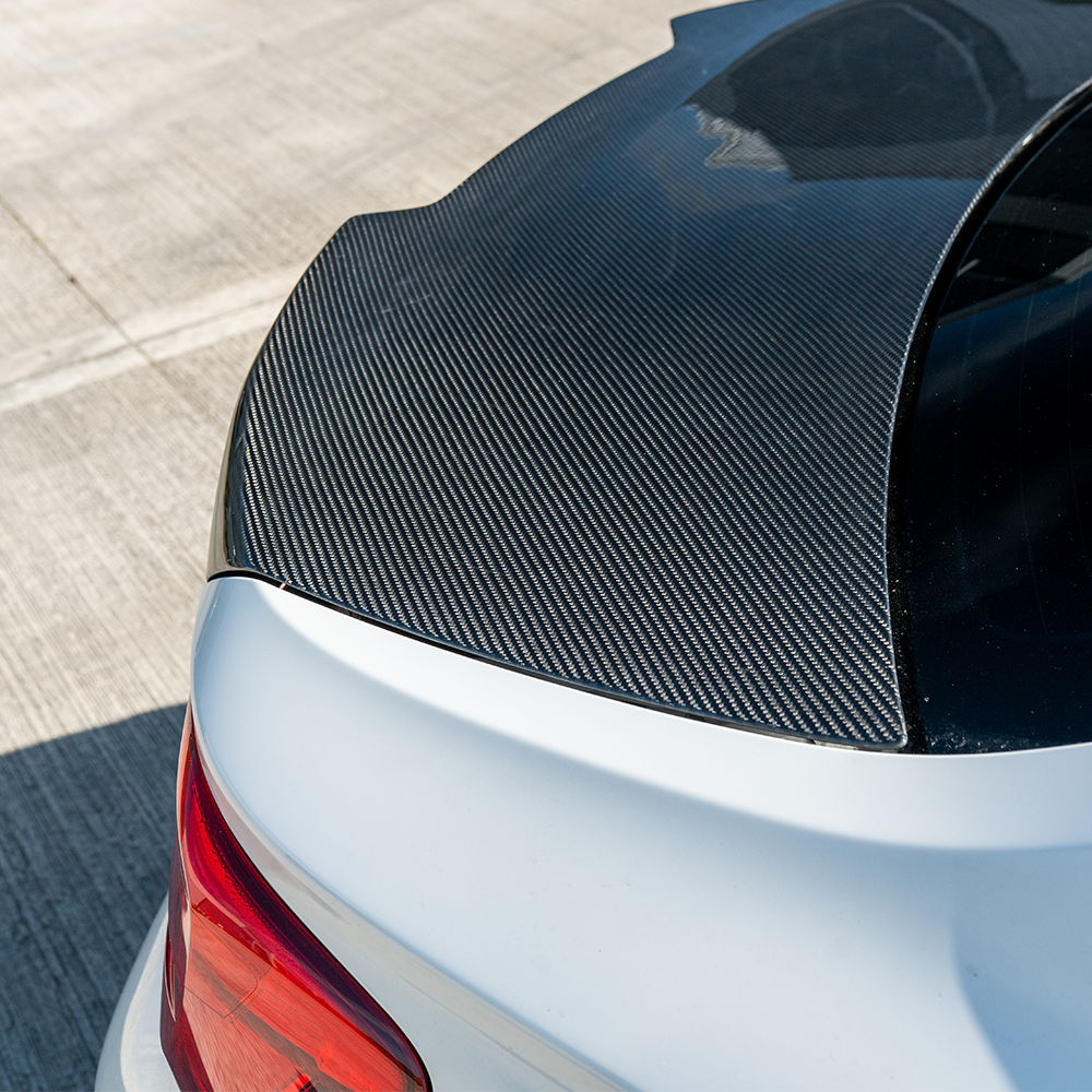 BMW M2 and M2C F87/F22 carbon fibre bootlid by CT Carbon, showing the sleek, lightweight sportscar trunk lid with carbon fiber finish.