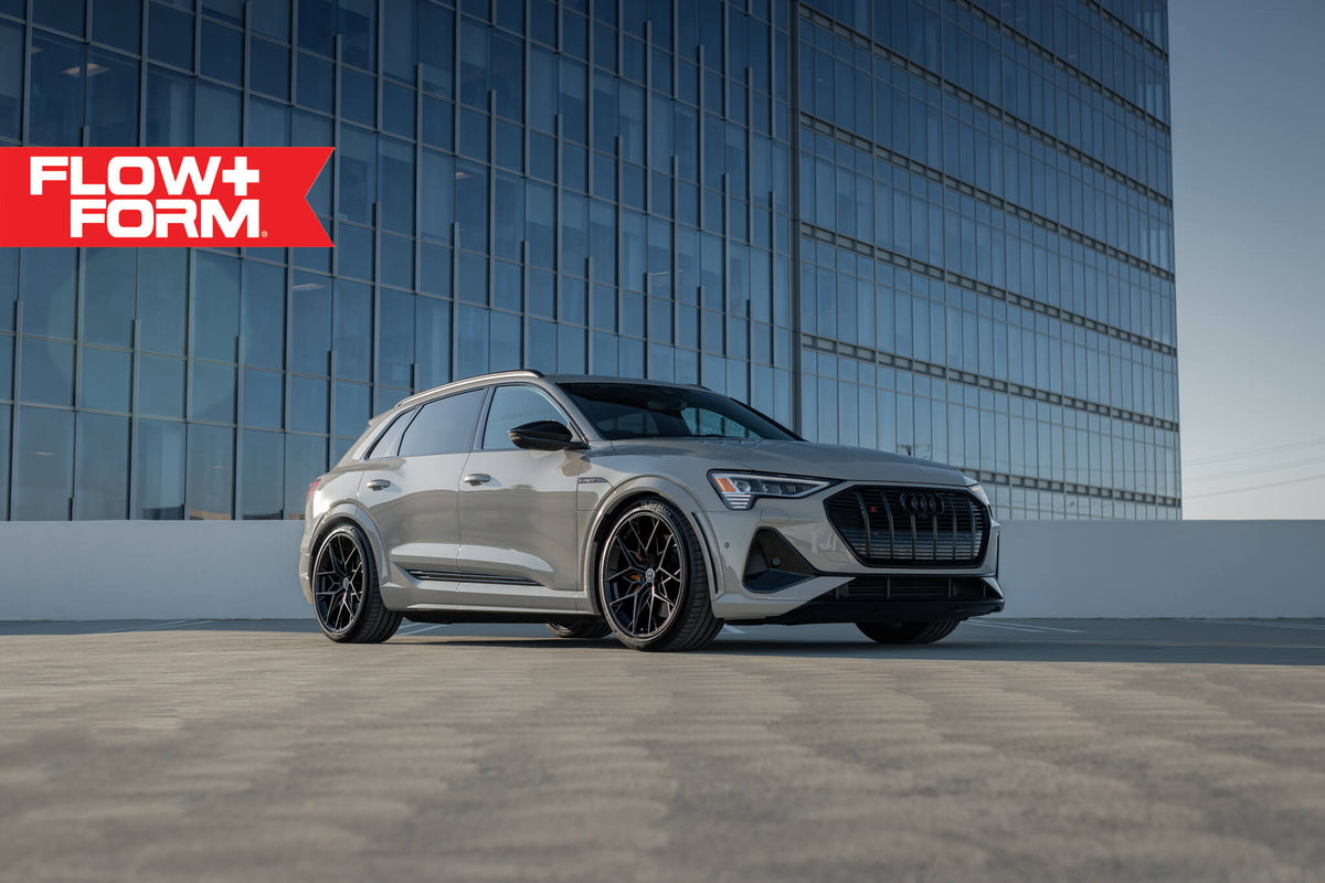 HRE PERFORMANCE WHEELS FF10 alloy wheel with multi-spoke design, shown in a sleek silver finish on a vehicle.