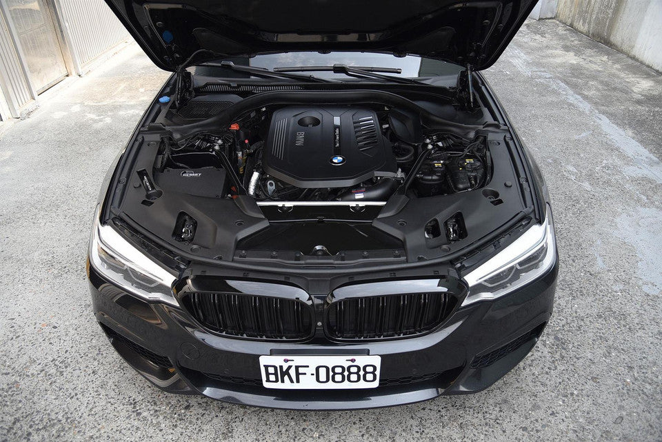 MST Performance induction kit installed in a BMW B58 540i engine bay, showcasing the aftermarket air intake system.