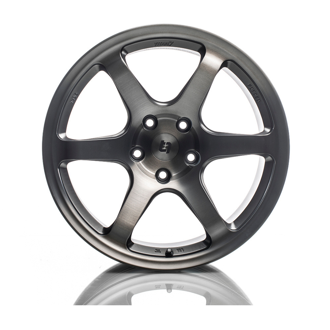 Titan 7 T-D6E forged 6-spoke alloy wheel showcasing a sleek, durable design with a metallic finish and intricate spoke pattern.