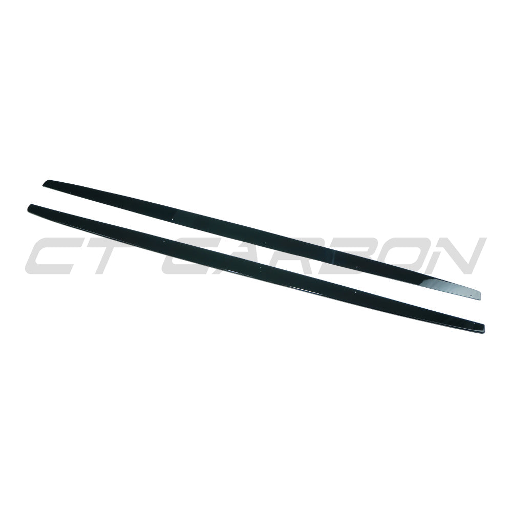 Gloss black side skirts for BMW 1 Series E82 E83 E87 E88 2004-2013 by CT Carbon, shown installed on the vehicle.