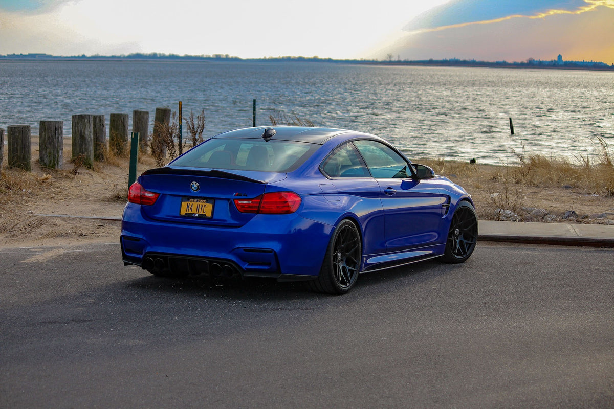 Pair of HRE PERFORMANCE WHEELS FF01 with black finish, featuring multi-spoke design on a silver car wheel.