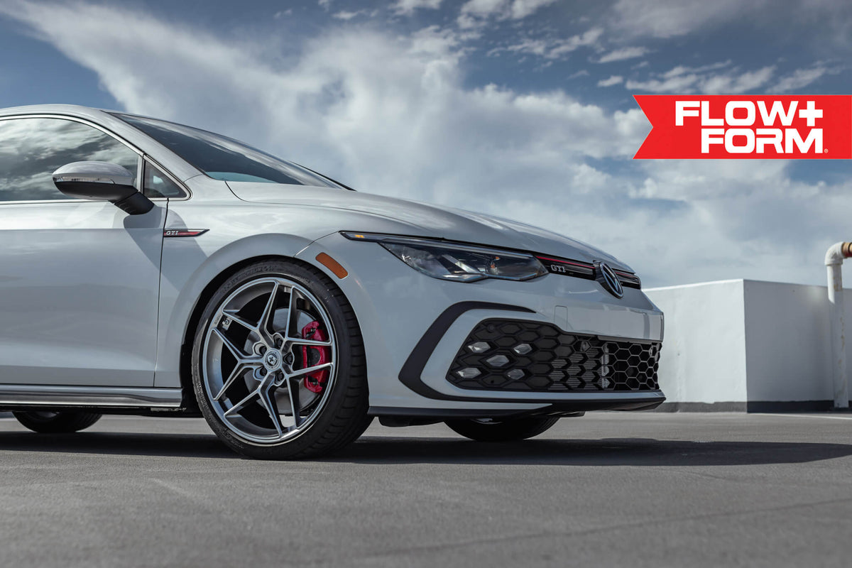 HRE PERFORMANCE WHEELS FF11 alloy wheels with a sleek multi-spoke design and metallic finish on a car rim.
