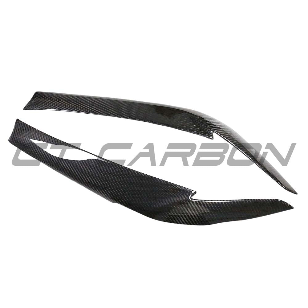 BMW G30 5 Series 2016-2023 dry carbon fiber eyelid accessories by CT Carbon, close-up of sleek, textured carbon fiber eyelid on vehicle.
