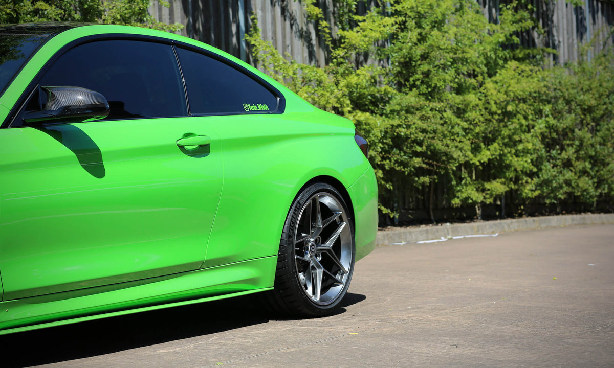 HRE PERFORMANCE WHEELS FF11 alloy wheels with multi-spoke design and polished finish on a vehicle.