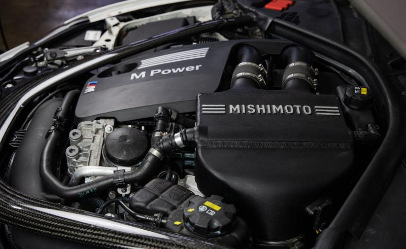 MISHIMOTO performance air-to-water intercooler for BMW F8X M3 M4, engine cooling component for 2015-2020 models.