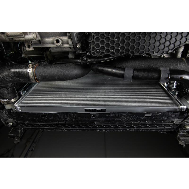 MISHIMOTO aluminum radiator for Volkswagen MK7 Golf TSI/GTI, 2015+; lightweight performance radiator with cooling fins visible.