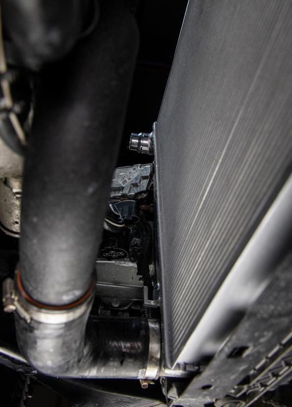 MISHIMOTO aluminum performance radiator for Volkswagen MK7 Golf TSI/GTI 2015+, showing sleek, lightweight design and cooling fins.