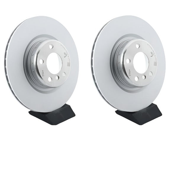 Pair of genuine BMW rear brake discs for 1, 2, 3, and 4 Series including M135i and M140i models, showing the brake disc surfaces.