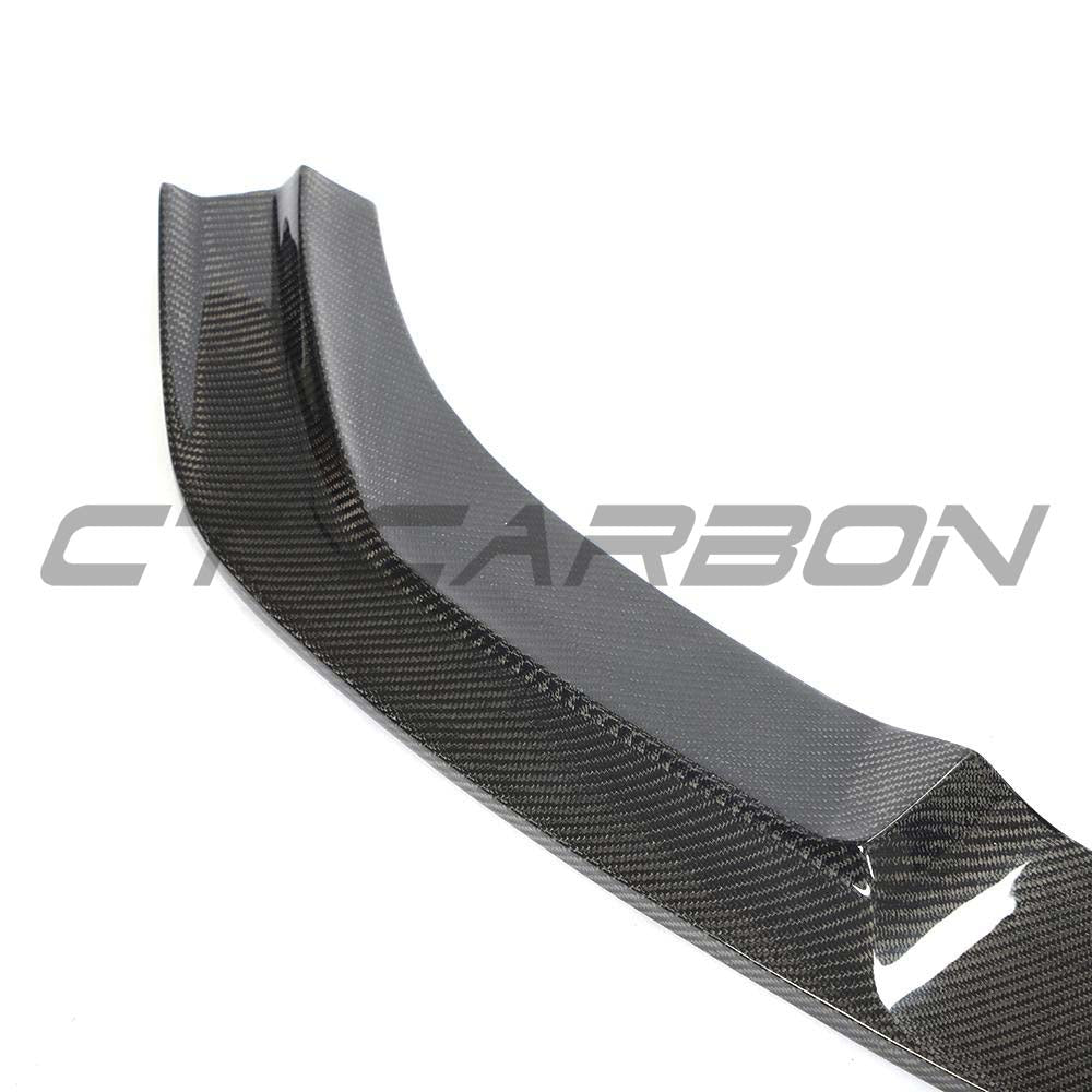 BMW F87 M2 carbon fiber full car kit by CT Carbon, includes hood, roof, and trunk components with sleek, lightweight carbon fiber finish.