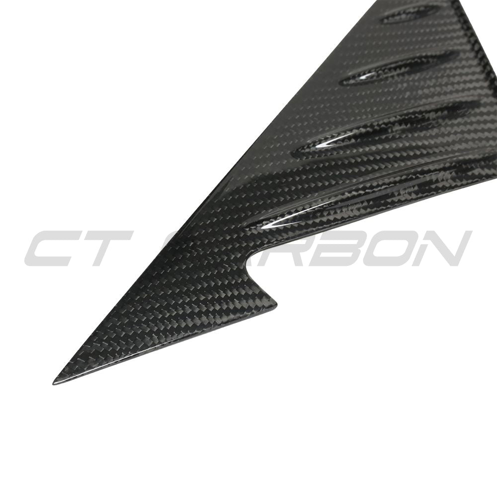 BMW M3 and 3 Series G80/G81/G20/G21 carbon fibre mirror pillar trim by CT Carbon, showing glossy, textured carbon fiber surface.