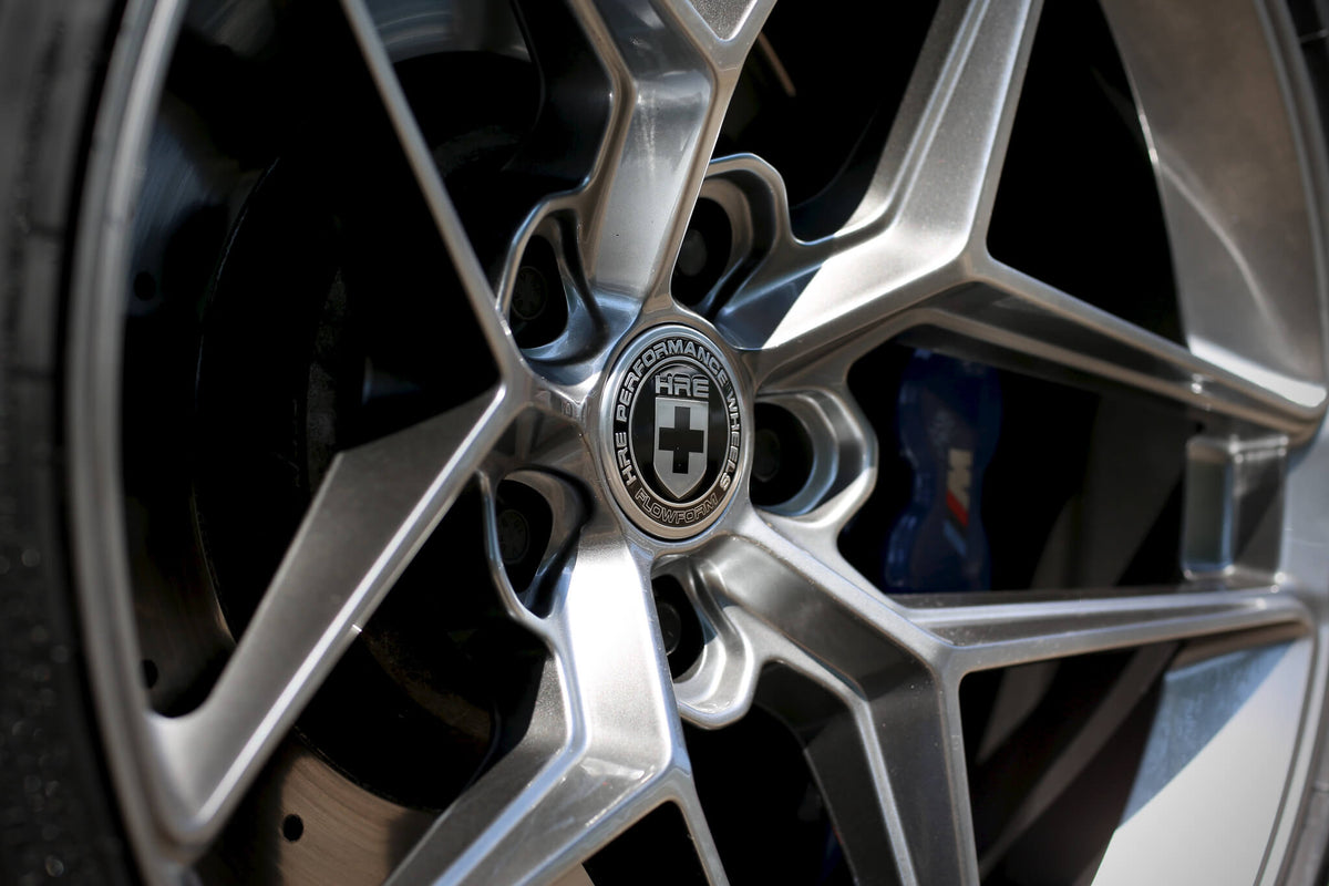 HRE PERFORMANCE WHEELS FF11 alloy wheels with multi-spoke design and polished finish on a vehicle.