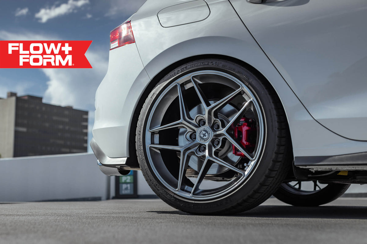 HRE PERFORMANCE WHEELS FF11 alloy wheel with multi-spoke design and polished finish, shown on a vehicle.