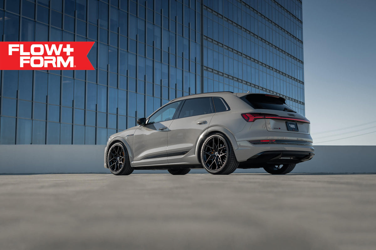 HRE PERFORMANCE WHEELS FF10 wheels with a sleek multi-spoke design and metallic finish, displayed on a vehicle.