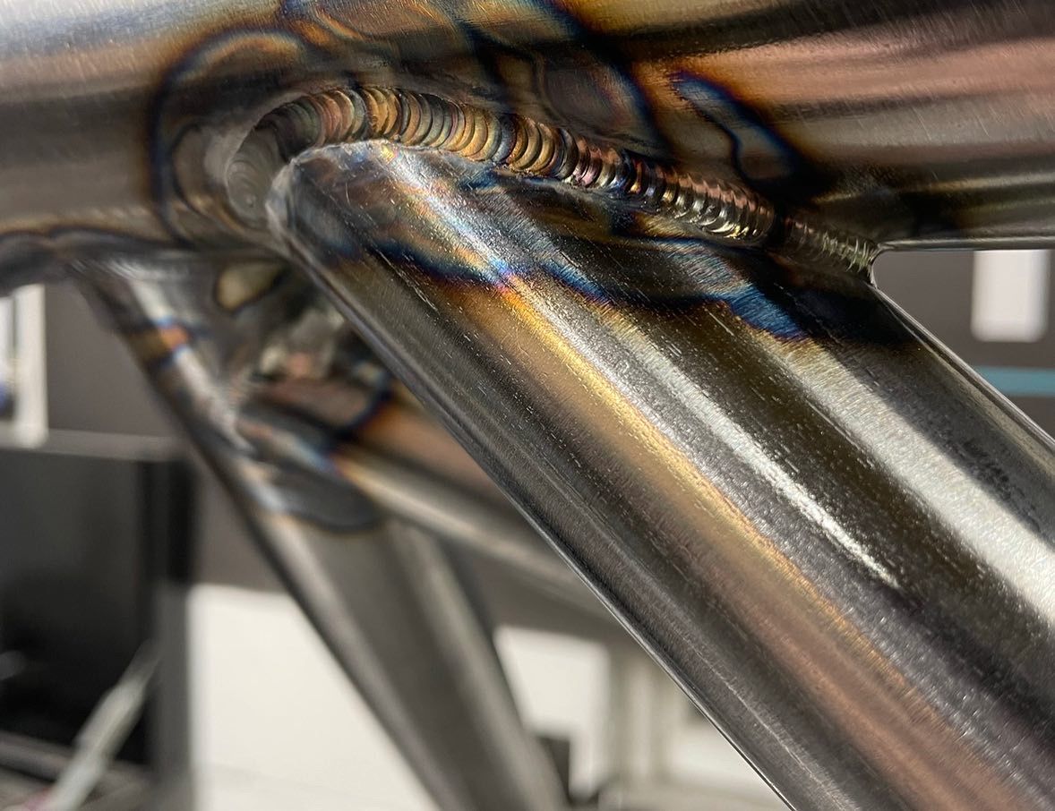 PINNACLE M4 GTS Style T45 half roll cage for race cars, featuring tubular steel construction and reinforced safety bars.