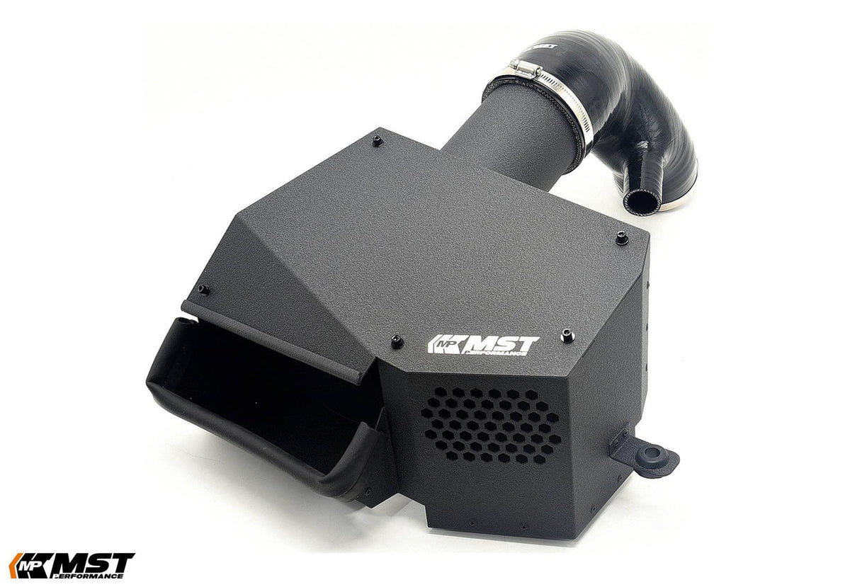 MST Performance induction kit for MK8 Golf EA888 EVO, showing air intake components and hoses installed in a vehicle engine bay.