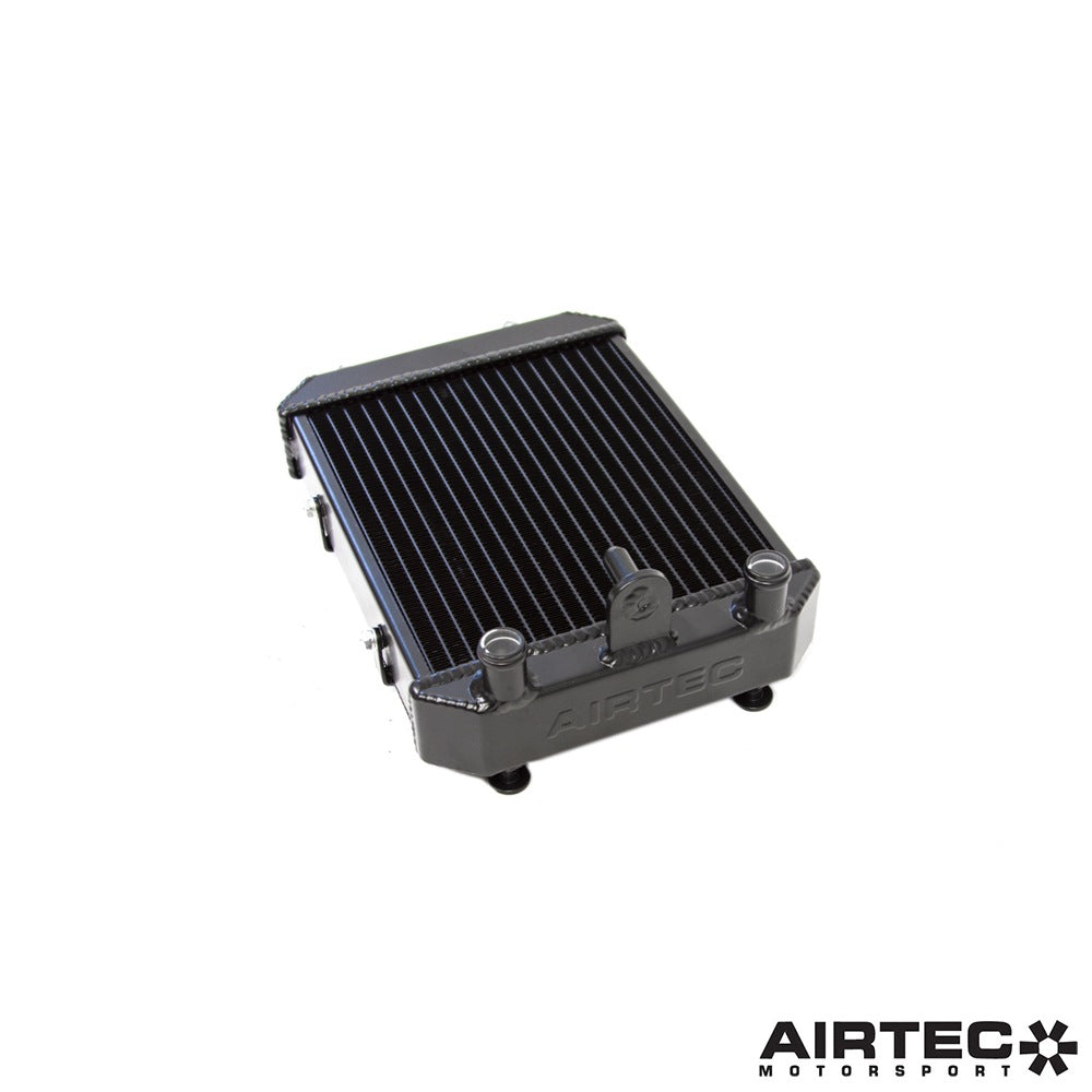 Airtec Motorsport auxiliary radiators for 1.8 and 2.0 TSI EA888 Gen 4 engines, installed in a vehicle engine bay.