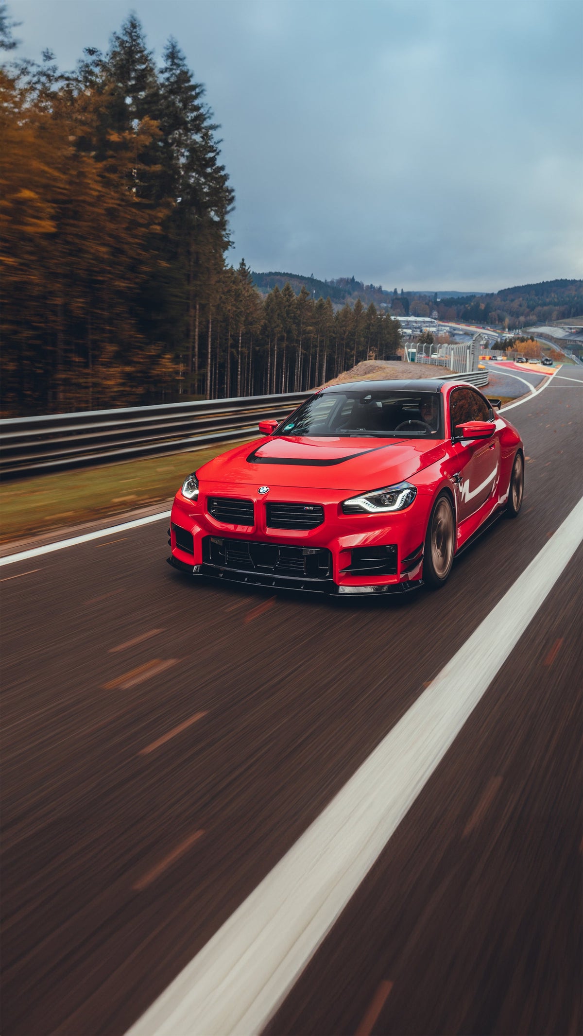 AC Schnitzer BMW M2 G87 front splitter installed on the car, showcasing aerodynamic enhancements and sleek design details.