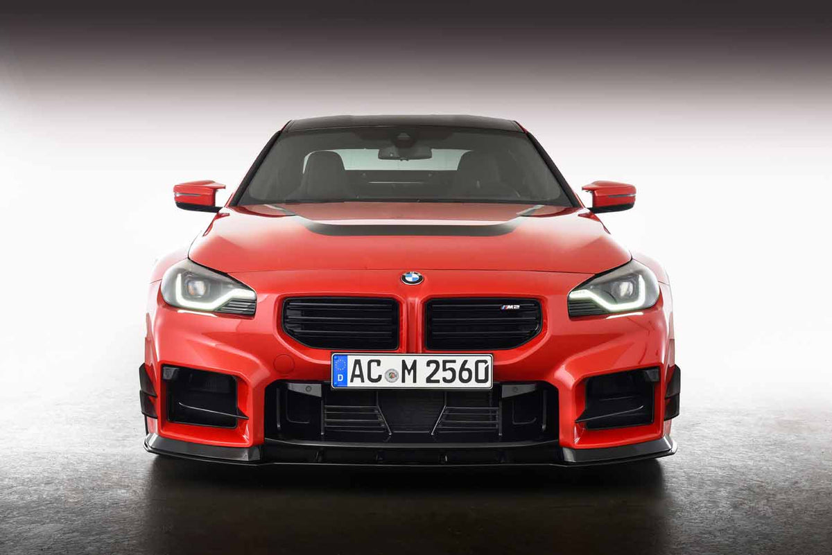 AC Schnitzer BMW M2 G87 front splitter, lightweight aerodynamic car part with sleek design for improved performance.