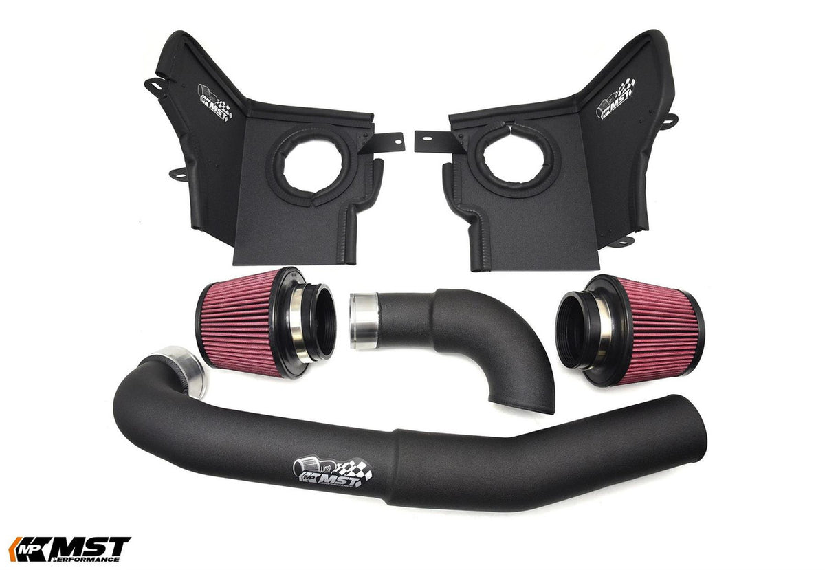 MST Performance induction kit for BMW M3/M4 G80/G82 Competition S58 engine, showing air intake components and piping.