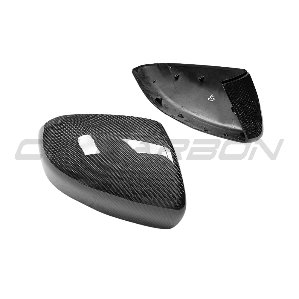 Carbon fiber side mirror covers for Land Rover Evoque L538 2012-2013 by CT Carbon, showcasing sleek, textured mirror accessories.