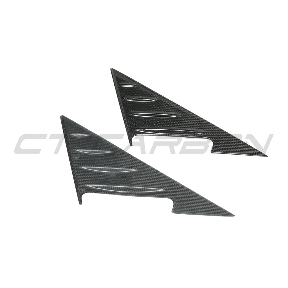 BMW M3 and 3 Series G80/G81/G20/G21 carbon fiber mirror pillar trim by CT Carbon, showing sleek, textured finish on vehicle side mirrors.