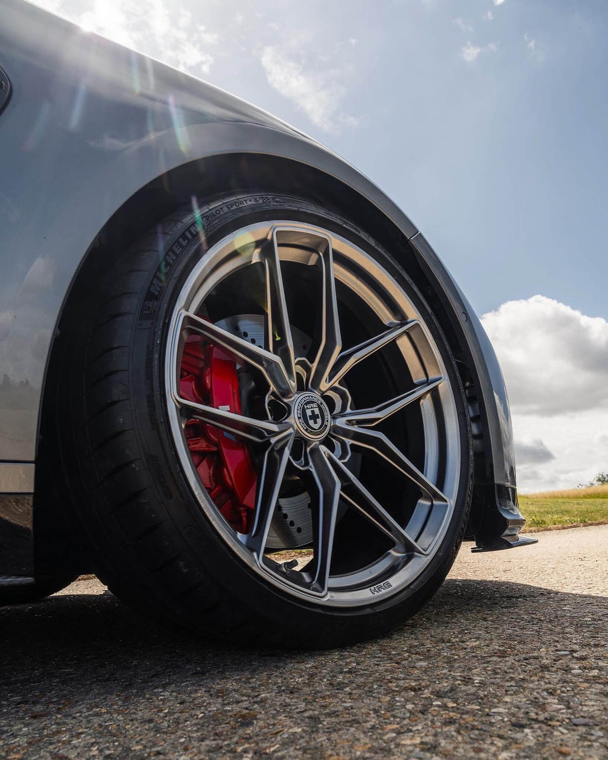 HRE PERFORMANCE WHEELS FF21 alloy wheel with a sleek multi-spoke design, metallic finish, and polished rim for sporty vehicles.