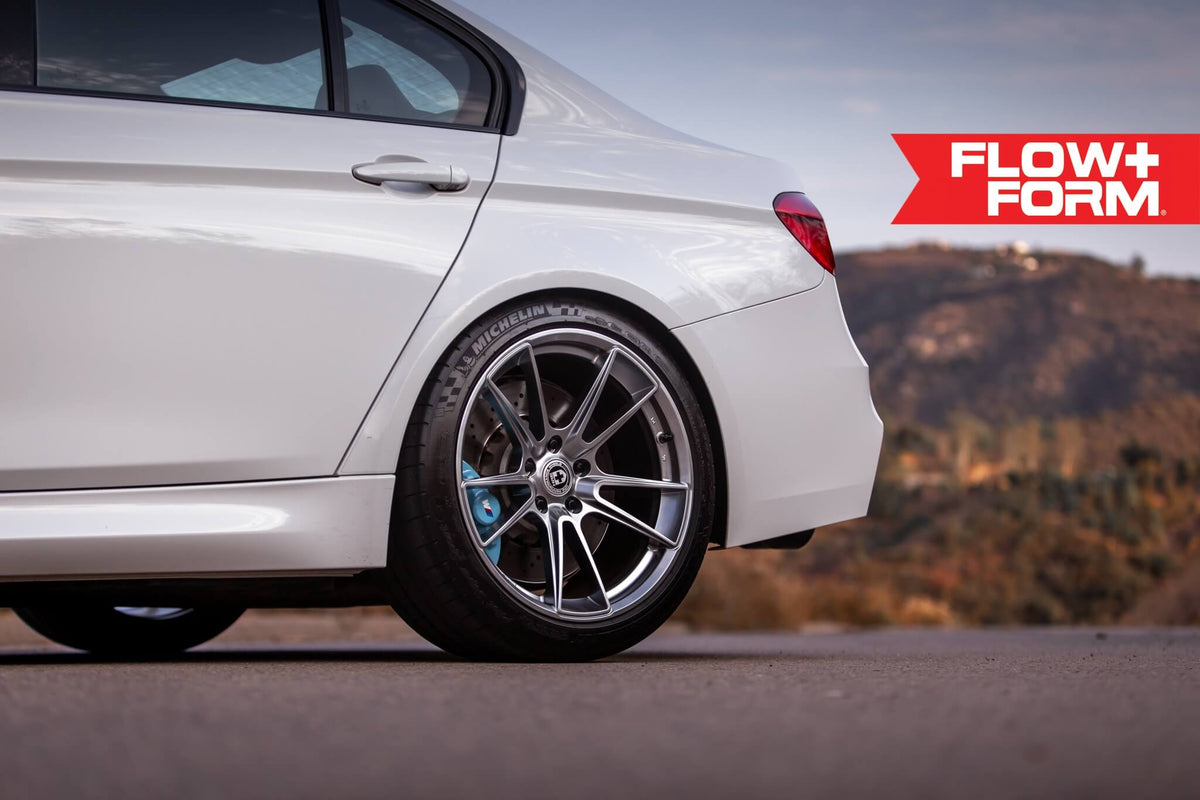 HRE PERFORMANCE WHEELS FF04 alloy wheel with five spokes, silver finish, mounted on a vehicle, detailed close-up image.