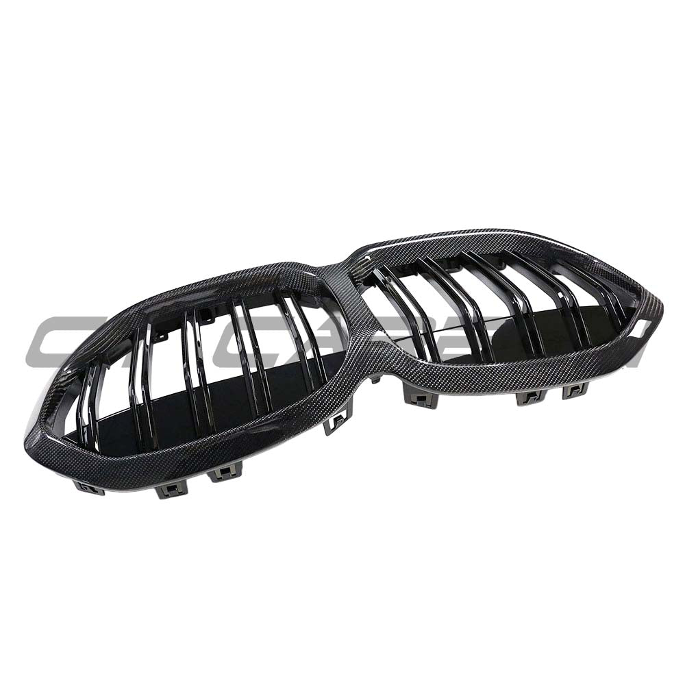 BMW F40 1 Series 2019-2024 carbon fiber front grille by CT Carbon, showing sleek black mesh design on the vehicle's front end.