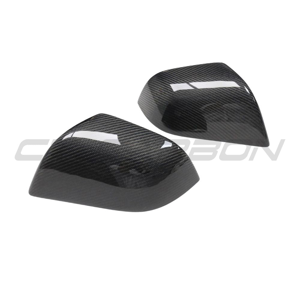 Tesla Model 3 2017-2023 carbon fiber side mirror covers by CT Carbon, showcasing sleek, lightweight automotive accessories.