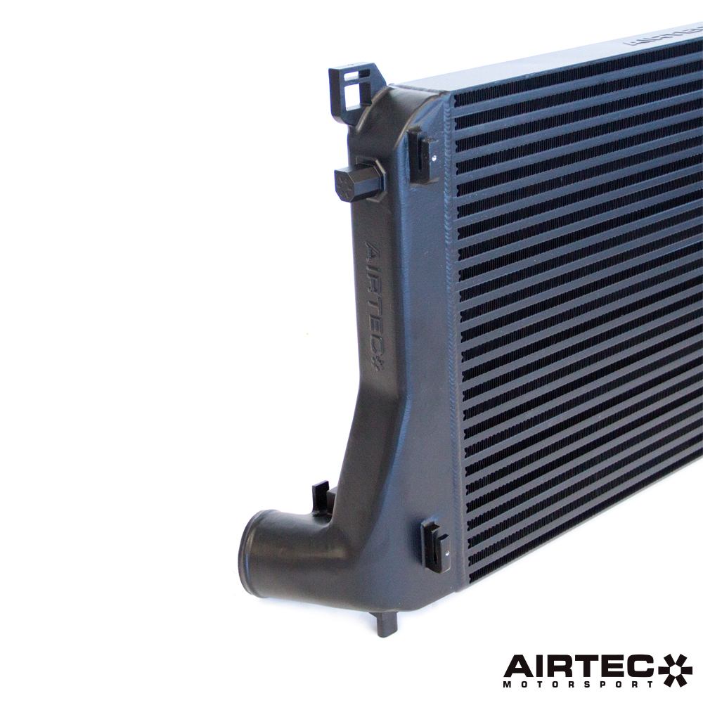 Airtec Motorsport EA888 MQB intercooler and big boost pipe hoses installed, showing black silicone hoses with metal clamps.