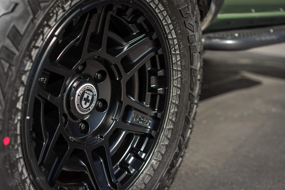 HRE PERFORMANCE WHEELS FT1 alloy wheel showing six-spoke design in polished finish on a vehicle.