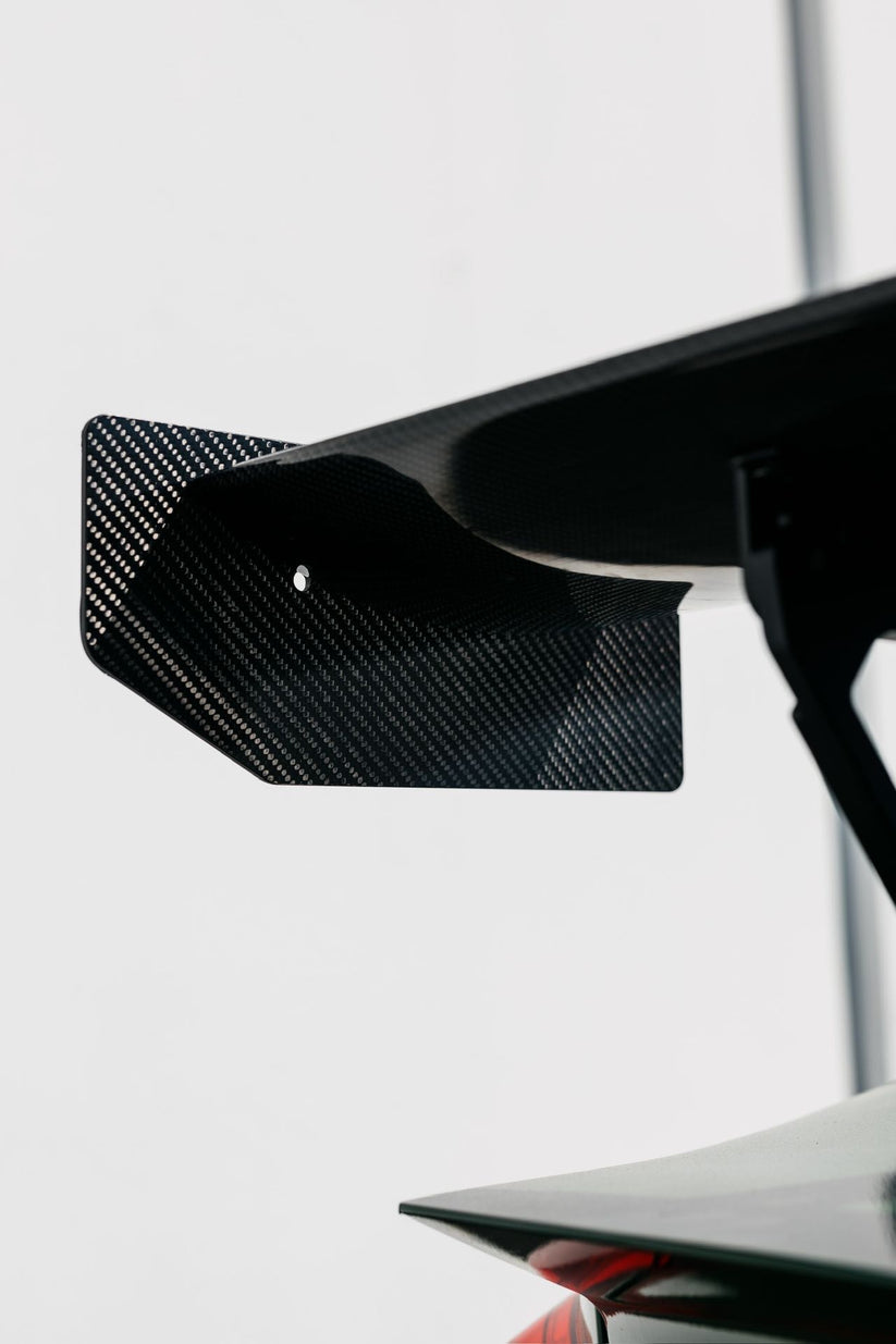 Ridgeline Motorsport Ring Spec Wing V2 spoiler made of dry carbon fiber, showcasing its sleek aerodynamic design and lightweight construction.