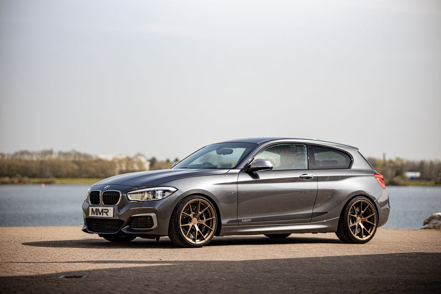 BIMECC STANCE KIT wheel spacers for BMW M3 F80, showing black 6J7A8055-35 spacer on car wheel for performance upgrade
