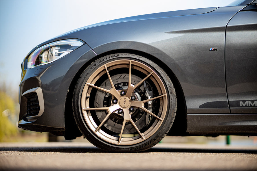 MMX Performance Sport Dampers by Bilstein for BMW F2x 1-Series and 2-Series suspension shocks, showing the shock absorber components.