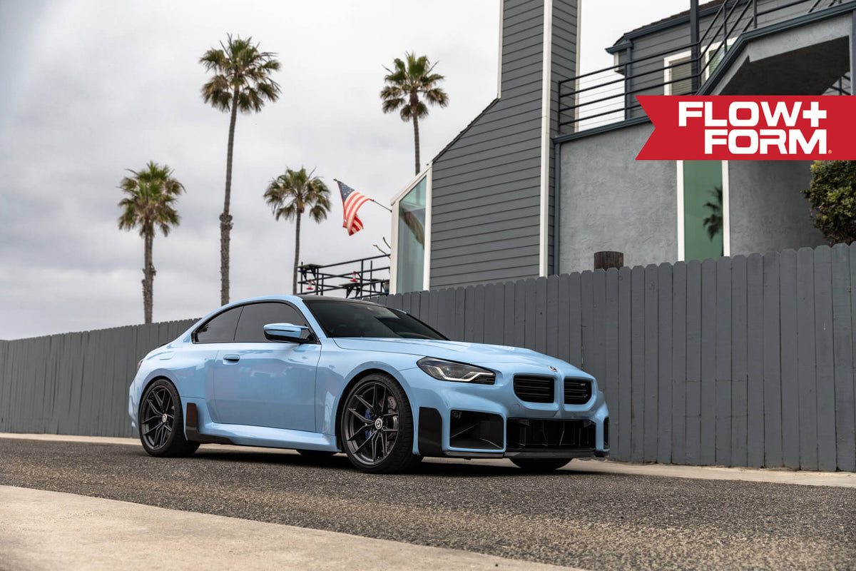 HRE Performance Wheels FF21 alloy wheel with a multi-spoke design and metallic finish, mounted on a vehicle.
