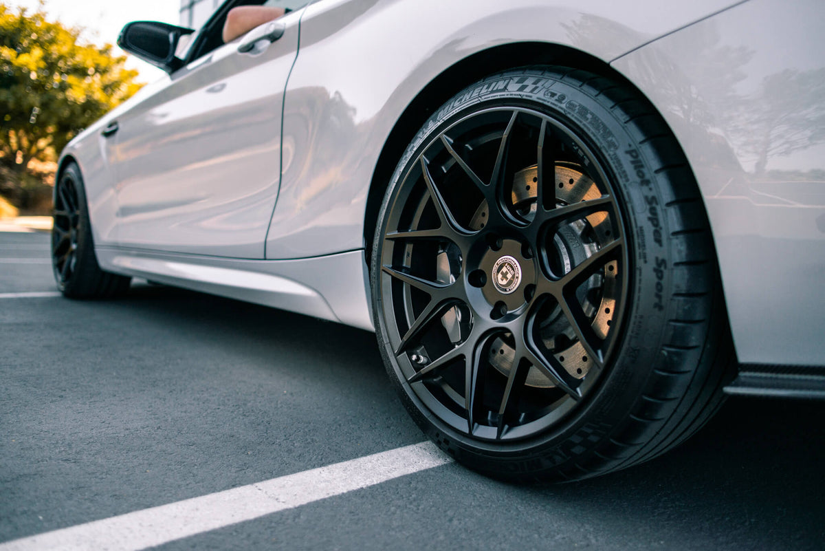 HRE PERFORMANCE WHEELS FF01 alloy wheels with a multi-spoke design, shown on a vehicle with a sleek, modern finish.