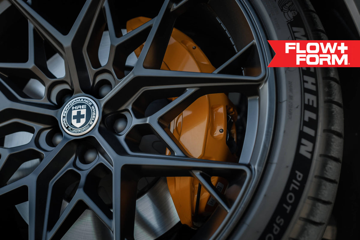 HRE PERFORMANCE WHEELS FF10 alloy wheels with multi-spoke design, showcased on a vehicle, in a close-up view.