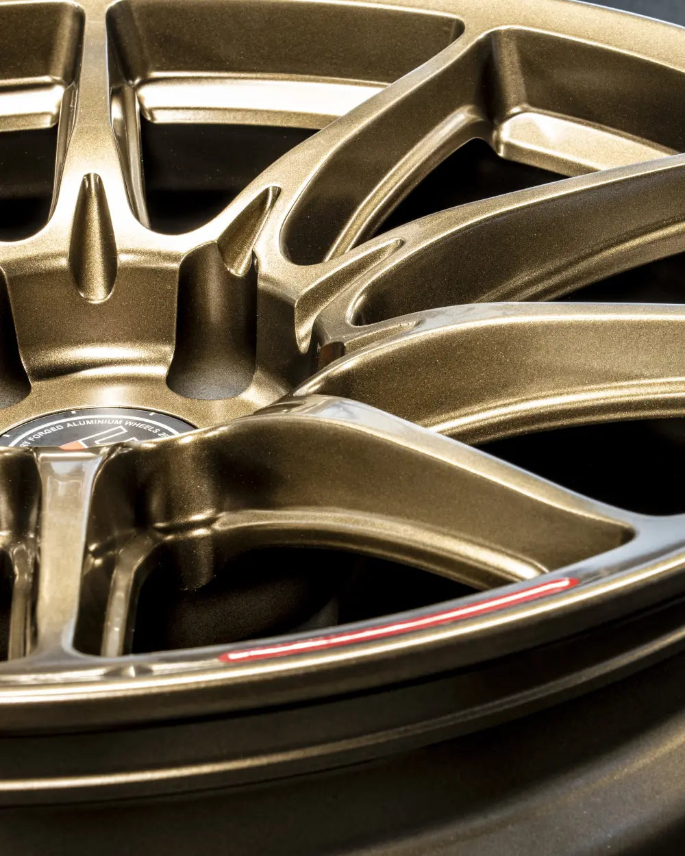 Close-up of 2Forge ZF8 semi-forged wheels showing intricate spoke design and metallic finish.