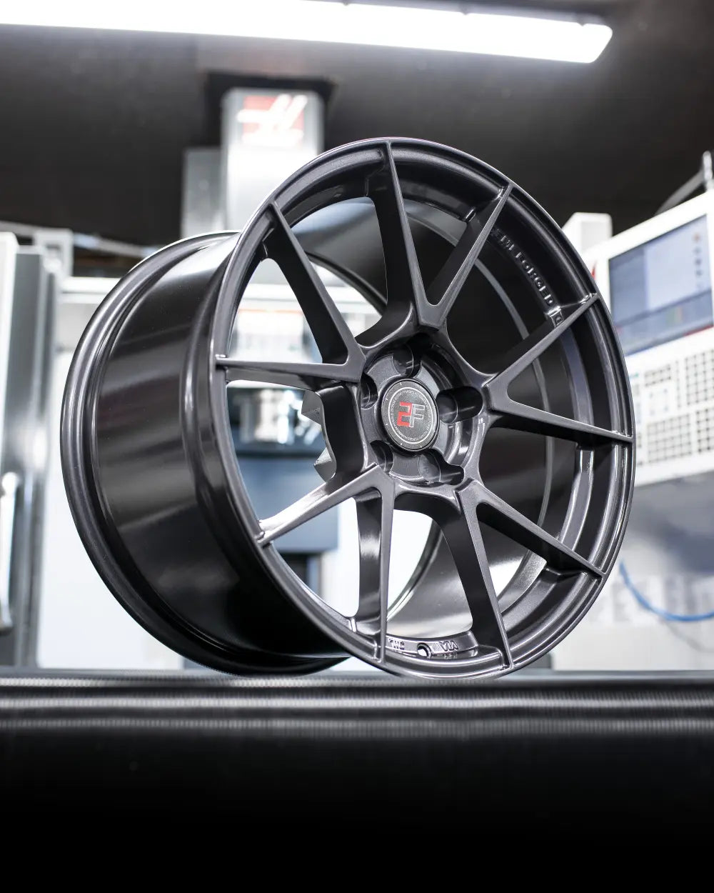 Close-up of 2Forge ZF6 semi-forged wheels showing intricate spoke design and metallic finish.