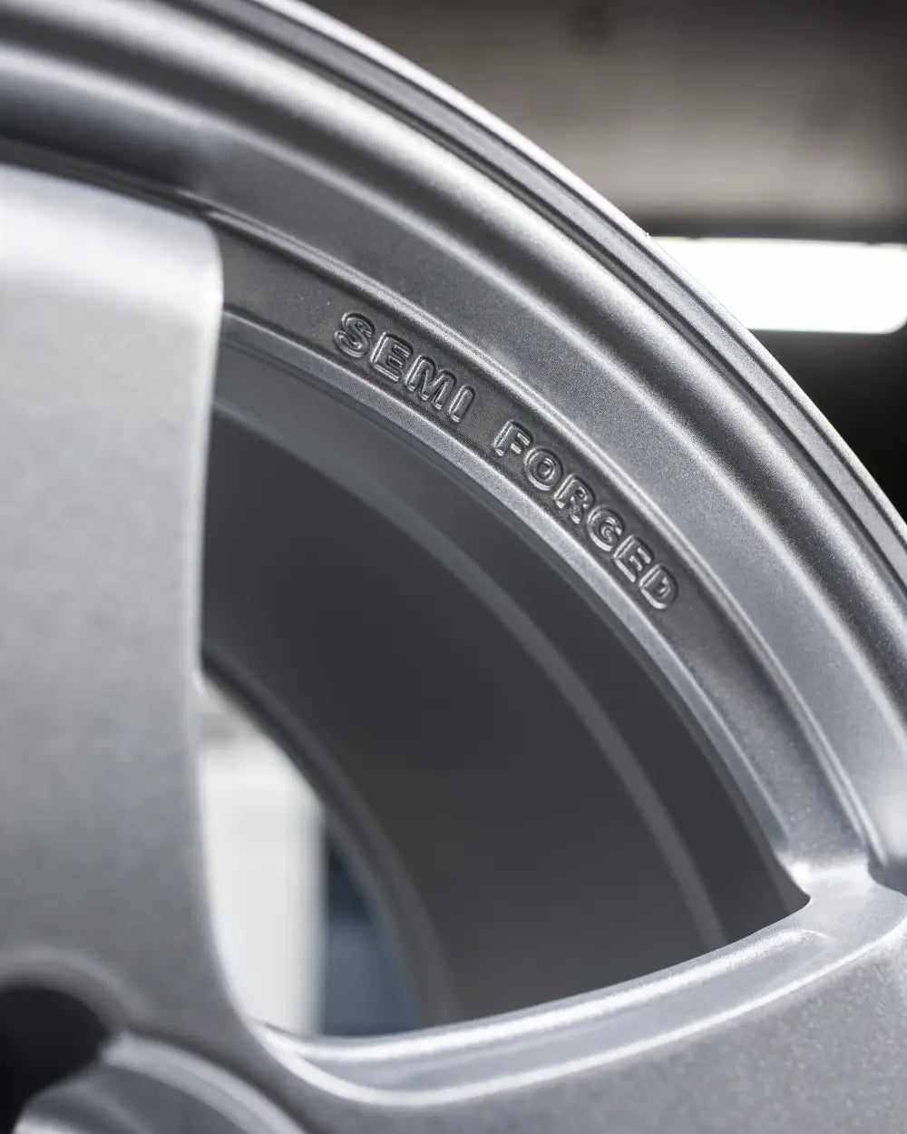 Close-up of 2Forge ZF7 semi-forged wheels showing the intricate spoke design and metallic finish.