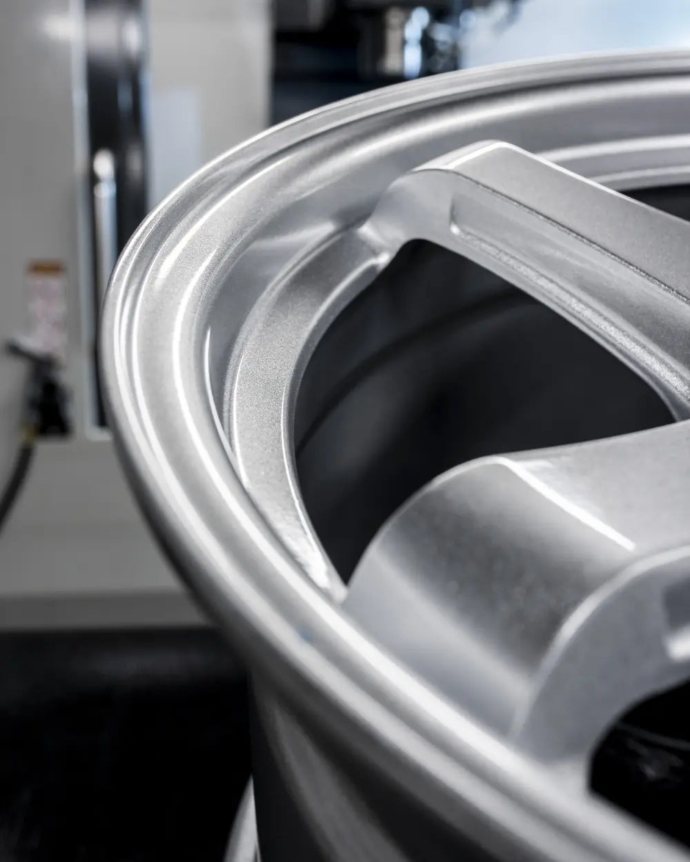 Close-up of 2Forge ZF7 semi-forged wheels showing intricate spoke design and metallic finish.