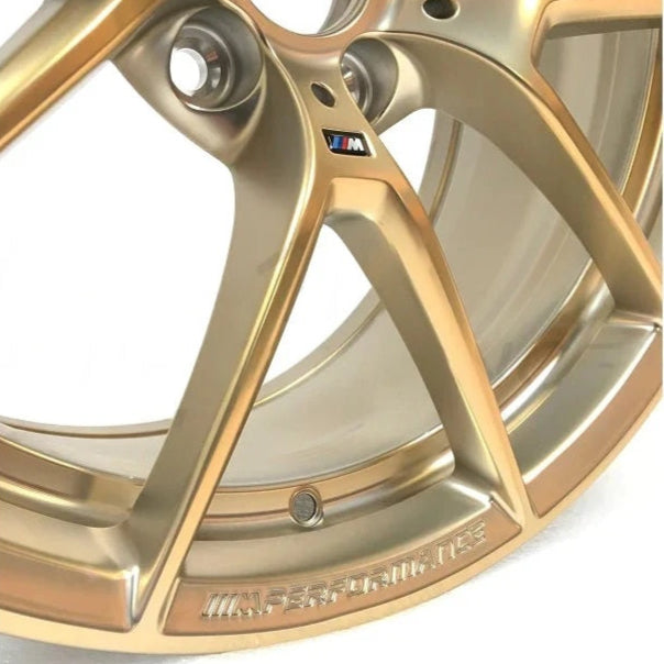 Genuine BMW F87 M2 763M Frozen Gold Wheel Set showing sleek alloy wheels with a glossy gold finish and intricate spoke design