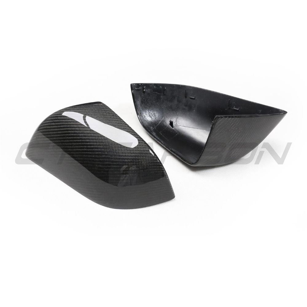 Carbon fiber side mirror covers for Tesla Model 3 2017-2023 by CT Carbon, showcasing sleek, lightweight automotive accessories.