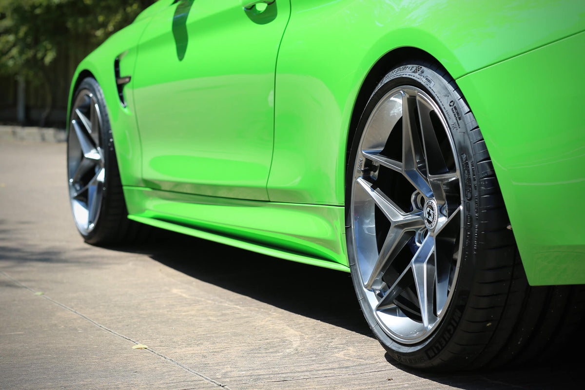 HRE PERFORMANCE WHEELS FF11 alloy wheels with a multi-spoke design, polished finish, and sleek automotive style.